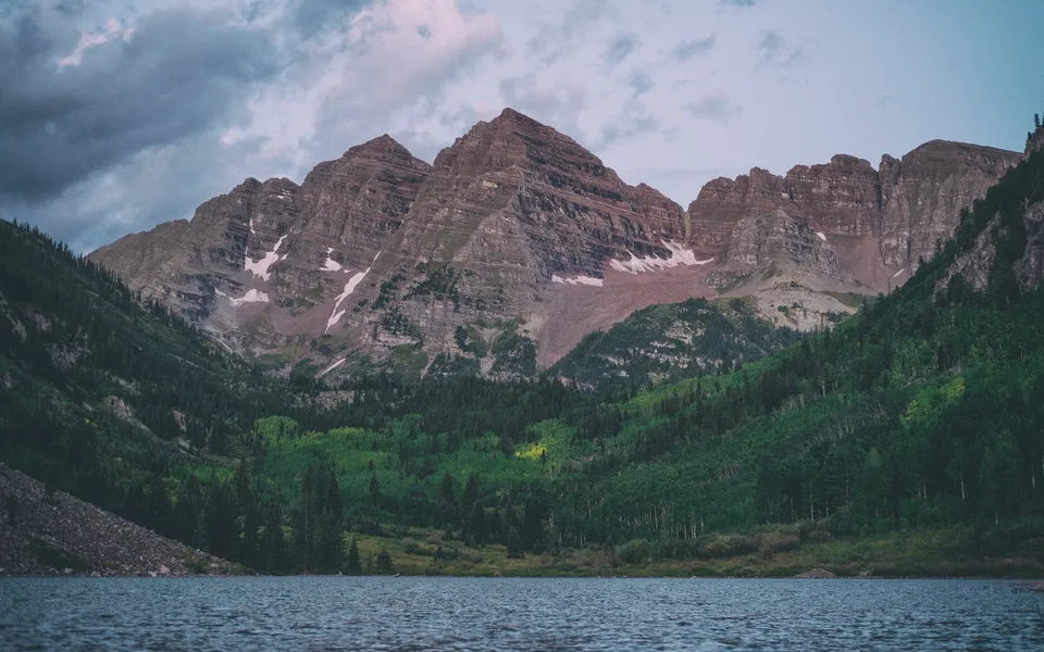 Maroon Bells reflected in a mountain lake near Aspen, Colorado